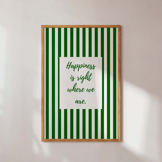 Framed green and white striped poster with motivational quote on a white wall