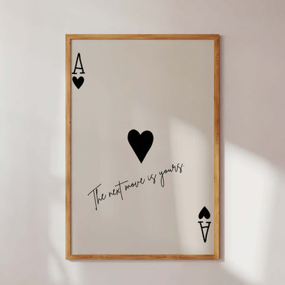 Framed artwork with playing card symbols and text on a white wall
