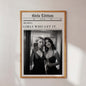 Framed poster with two women taking a selfie and text 'Girls Edition' on a white wall.