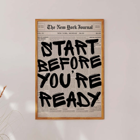 Framed poster with motivational quote 'Start Before You're Ready' on a white wall.