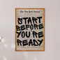 Framed poster with motivational quote 'Start Before You're Ready' on a white wall.