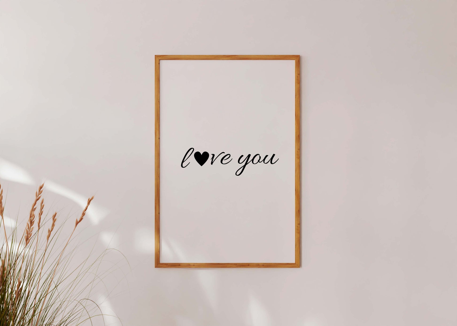 Minimalist love quote poster in wooden frame aesthetic