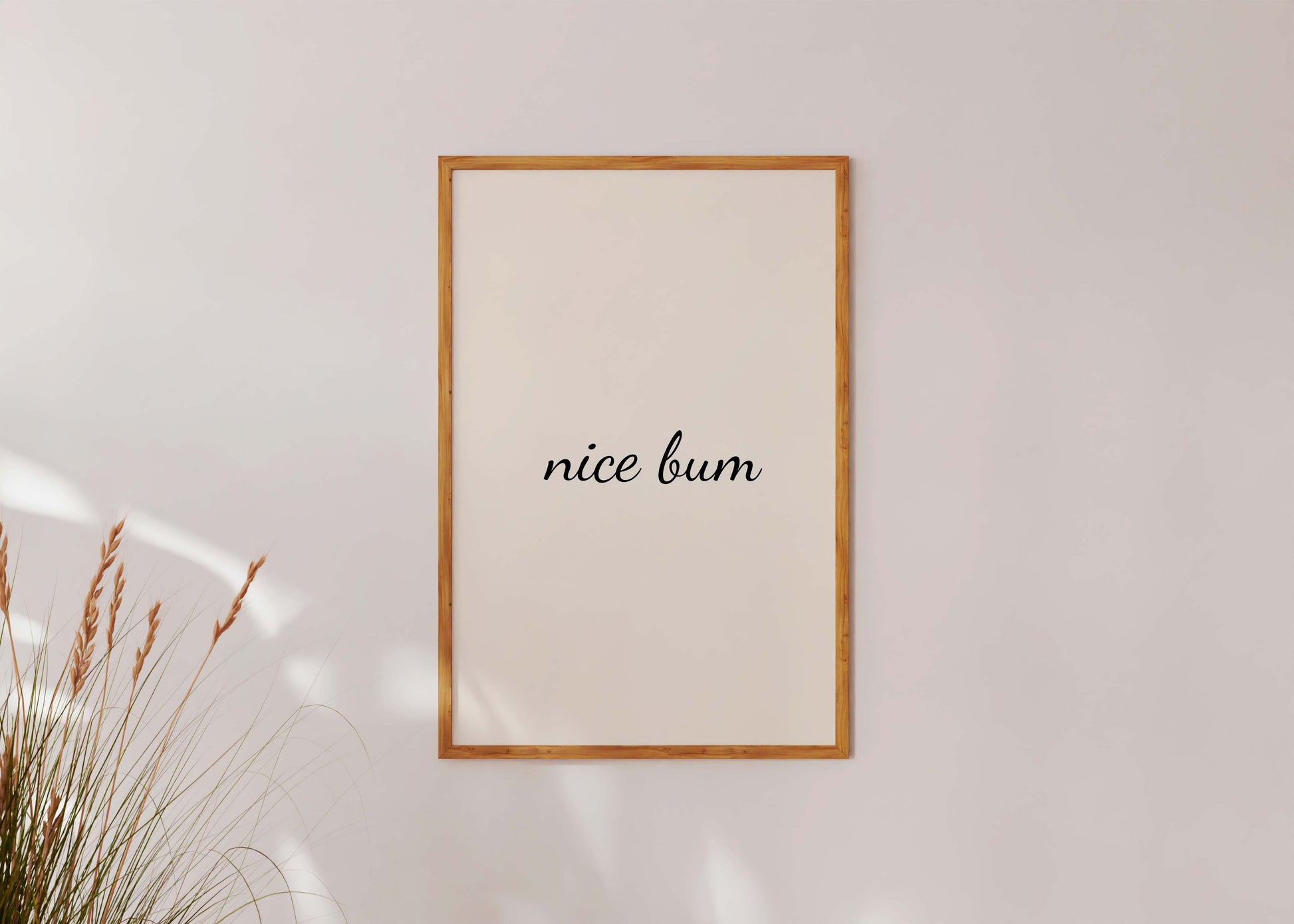 Funny typography wall art leaning against sofa aesthetic decor
