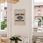 Framed poster with 'Less Talk, More Action' quote in a living room setting.