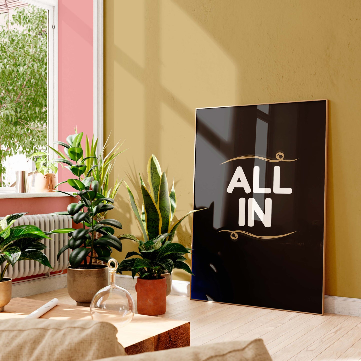 Living room with plants and a framed poster on a yellow wall