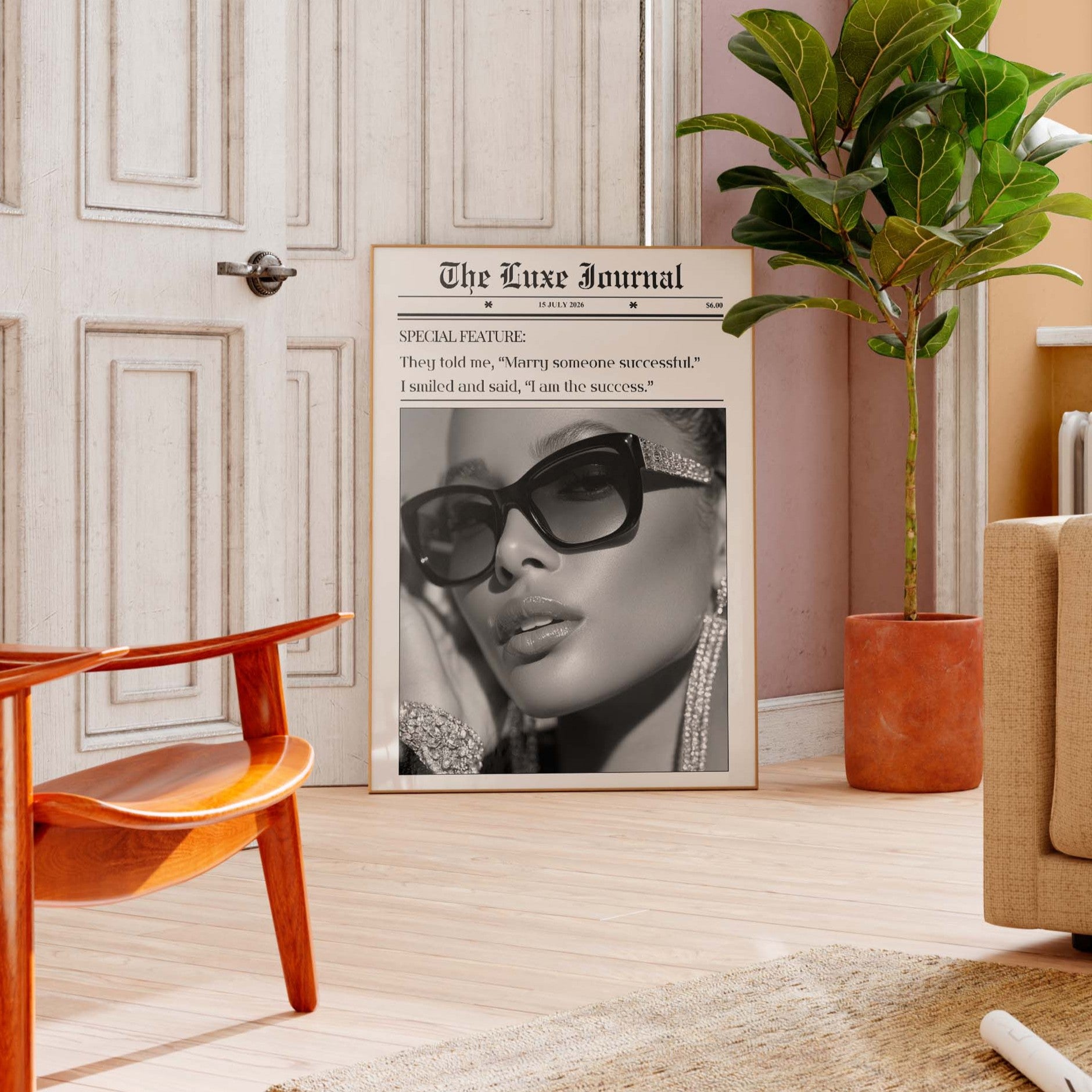 Living room with a framed newspaper featuring a woman's face, orange chair, and plant.
