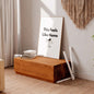 Wooden bench with a framed picture in a cozy living room setting