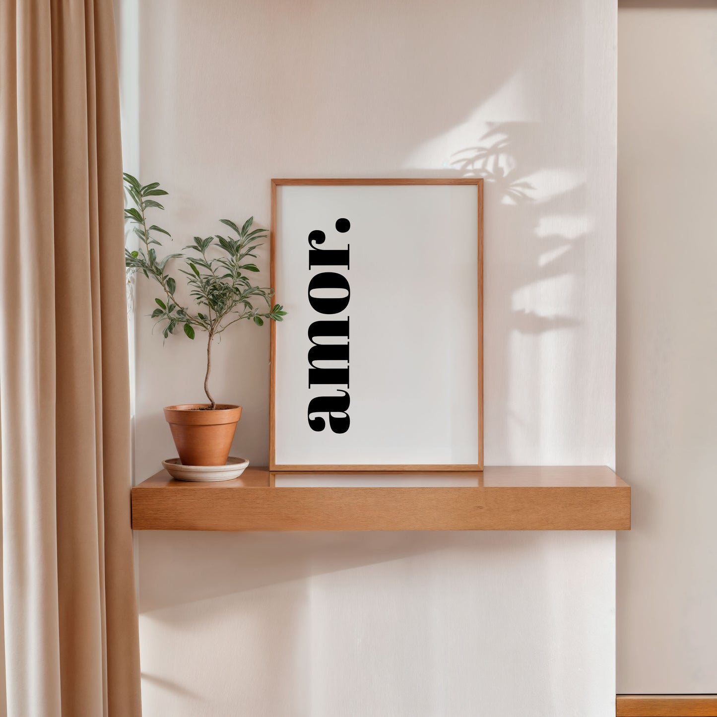Modern black and white Amor wall art in minimalist interior