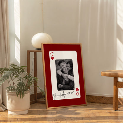Large personalized playing card wall art in modern living room with chair and decor